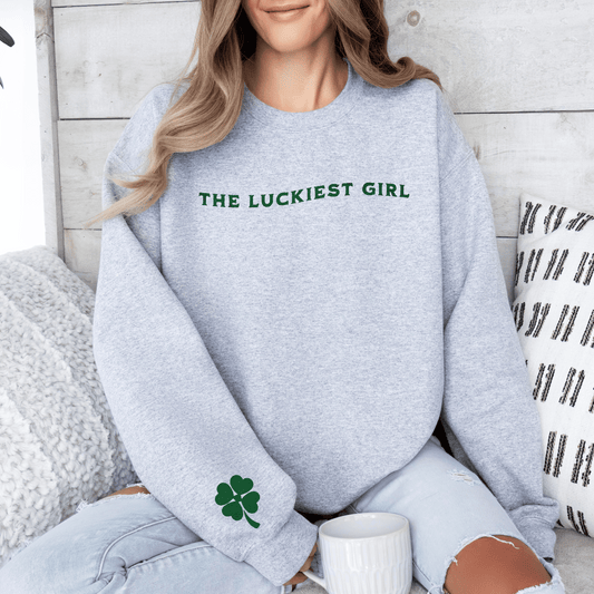Stay Lucky with Our 'The Luckiest Girl' - Featuring a Charming Sleeve Shamrock Detail Unisex Sweatshirt