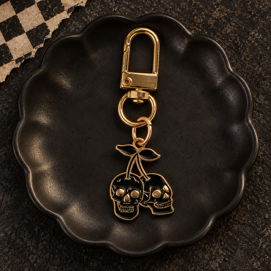 Black and gold cherry skull bag charm
