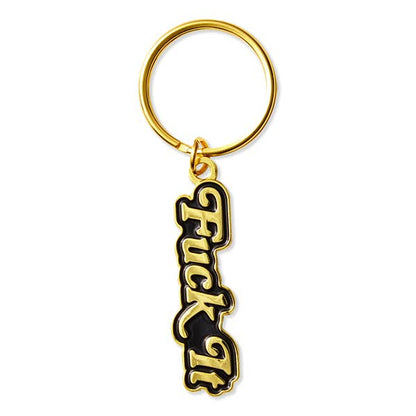 Keychain with gold ring and black and gold 'F*ck It' text on a white background